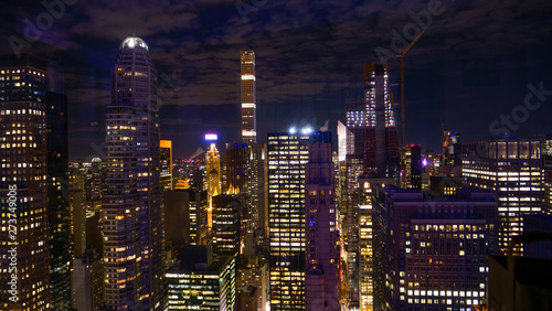 CLOSE UP: Breathtaking view of countless skyscrapers of New York lit up at night © helivideo