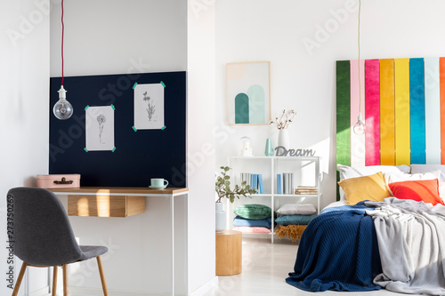 Colorful bedroom interior with king size bed and home office © Photographee.eu