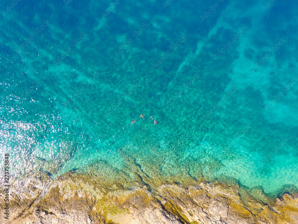 Aerial view of tourists swimming in beautiful clear sea water Aerial view of tourists swimming in beautiful clear sea water