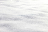 Beautiful sunny bright snow texture winter season copy space background. Selective focus used.