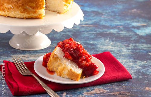 Slice of Strawberry Short Cake Made with Angel Food Cake and Strawberry Sauce photo