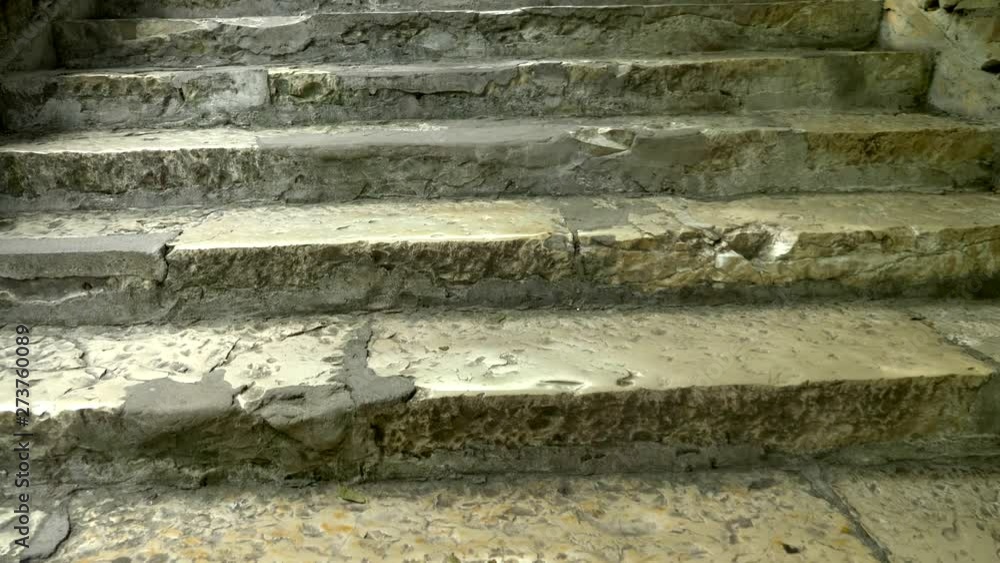 close-up. Old damaged stone staircase, upwards. textured background close-up. Old damaged stone staircase, upwards. textured background