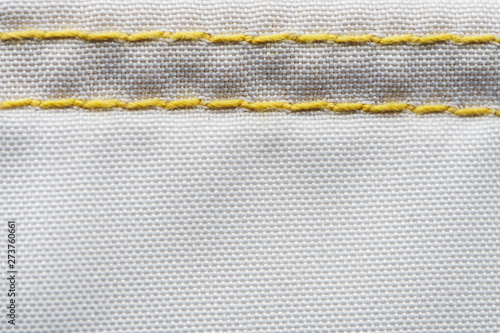 Finishing seam of a sports backpack close-up shot. Sport nylon fabric texture
