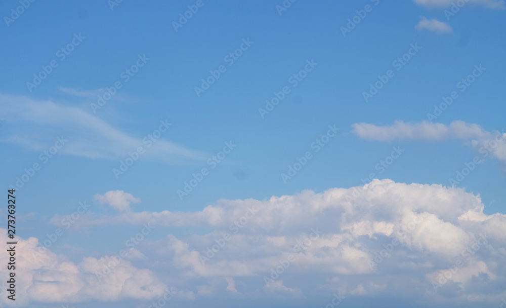 blue sky and clouds on a clear sunny summer day blue sky and clouds on a clear sunny summer day
