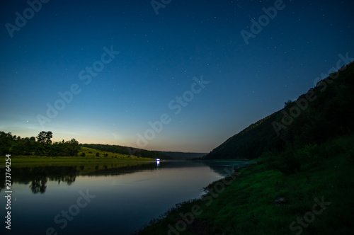 Stars on a moonlit night above the Dniester River
