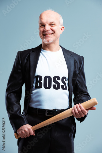 Fotografia Gleeful Boss standing wielding a baseball bat