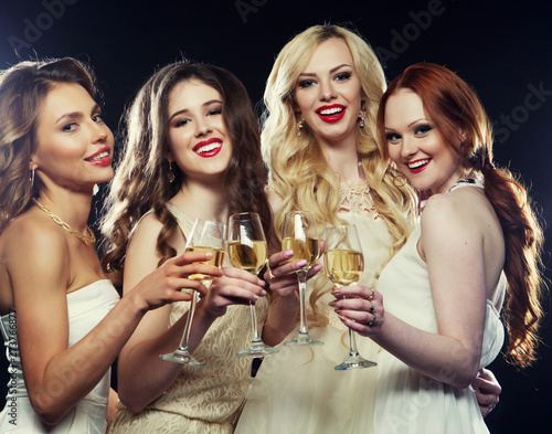 lifestyle, party and people concept - Group of partying girls clinking flutes with sparkling wine