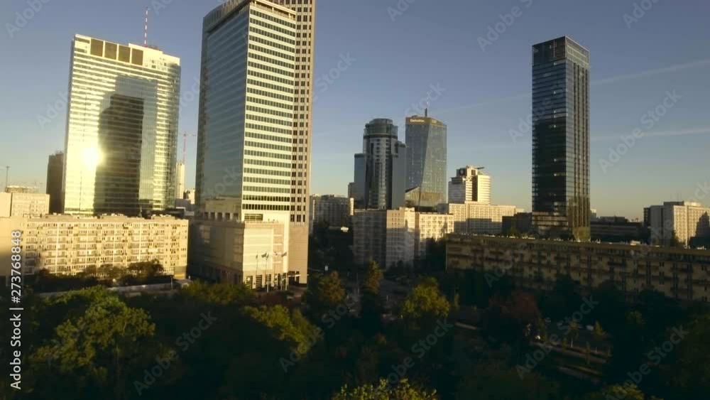 Aerial sunrise with a view of the city of Warsaw / Poland. Reflection of the sun in glass skyscrapers. Downtown business bay commercial district. Shot on 4k, drone RAW. Aerial sunrise with a view of the city of Warsaw / Poland. Reflection of the sun in glass skyscrapers. Downtown business bay commercial district. Shot on 4k, drone RAW.