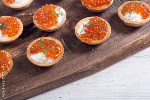 Tartalets with red caviar