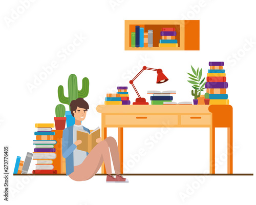 man with book in hands in living room