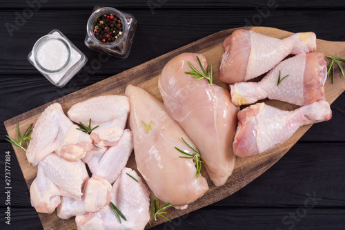 Raw chicken meat on wooden background