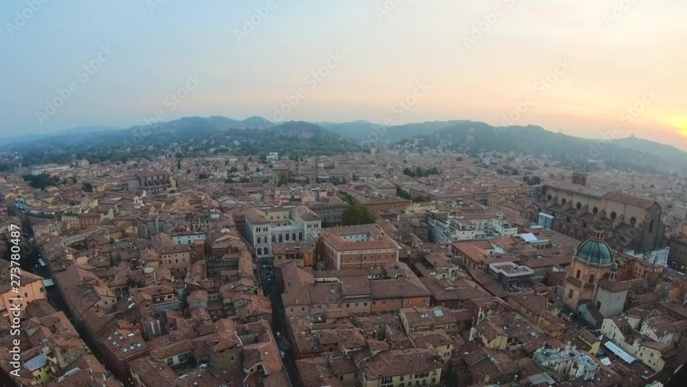 Bologna, Italy city view from the Asinelli tower passing through window grille Bologna, Italy city view from the Asinelli tower passing through window grille
