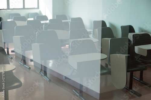 Desk and chairs in classroom background