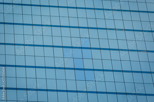 Blue glass windows of office building