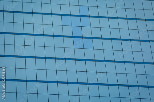 Blue glass windows of office building