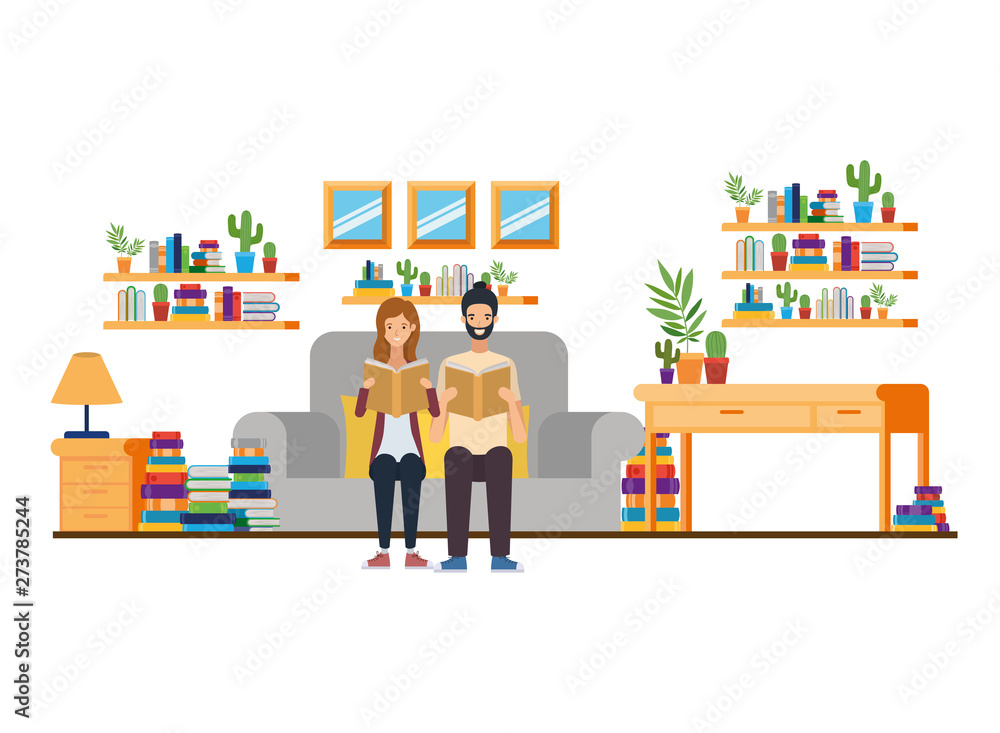 couple with book in hands in living room couple with book in hands in living room