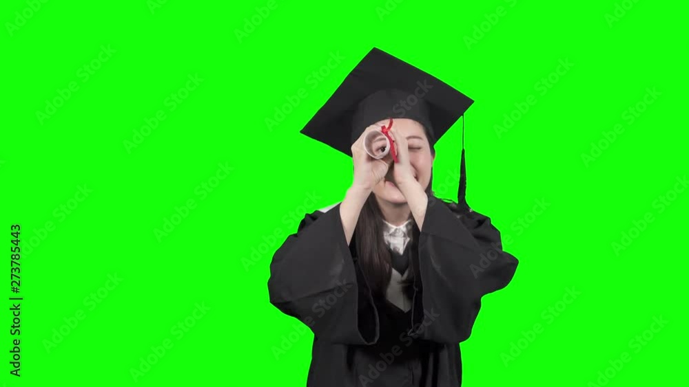graduate asian korean teen girl student in black graduation gown with hat holding diploma isolated on green background. woman back to school educational concept. new fresh people telescope search job graduate asian korean teen girl student in black graduation gown with hat holding diploma isolated on green background. woman back to school educational concept. new fresh people telescope search job