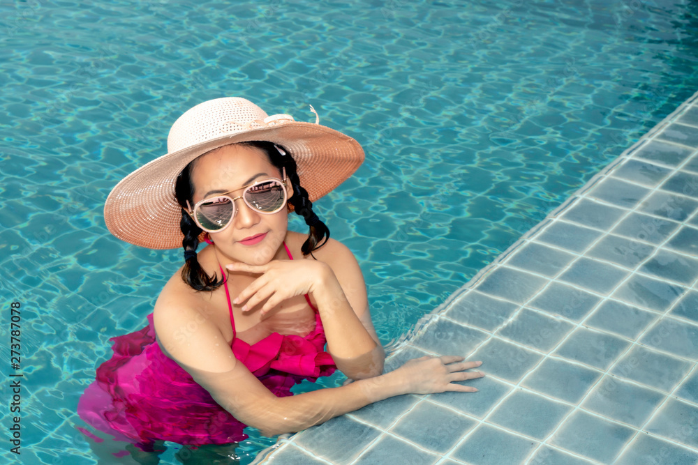 Asian woman in the swimming pool