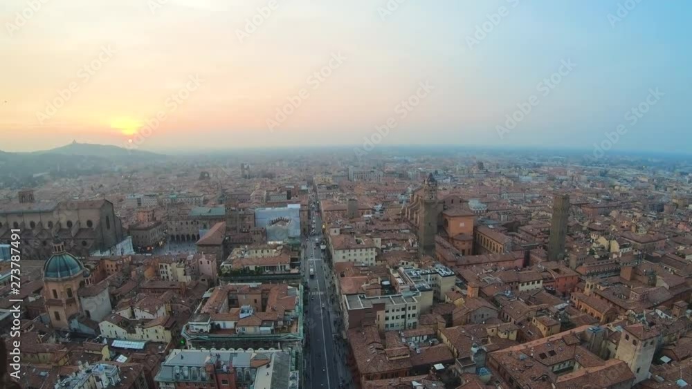 Bologna, Italy city view from the Asinelli tower passing through window grille Bologna, Italy city view from the Asinelli tower passing through window grille