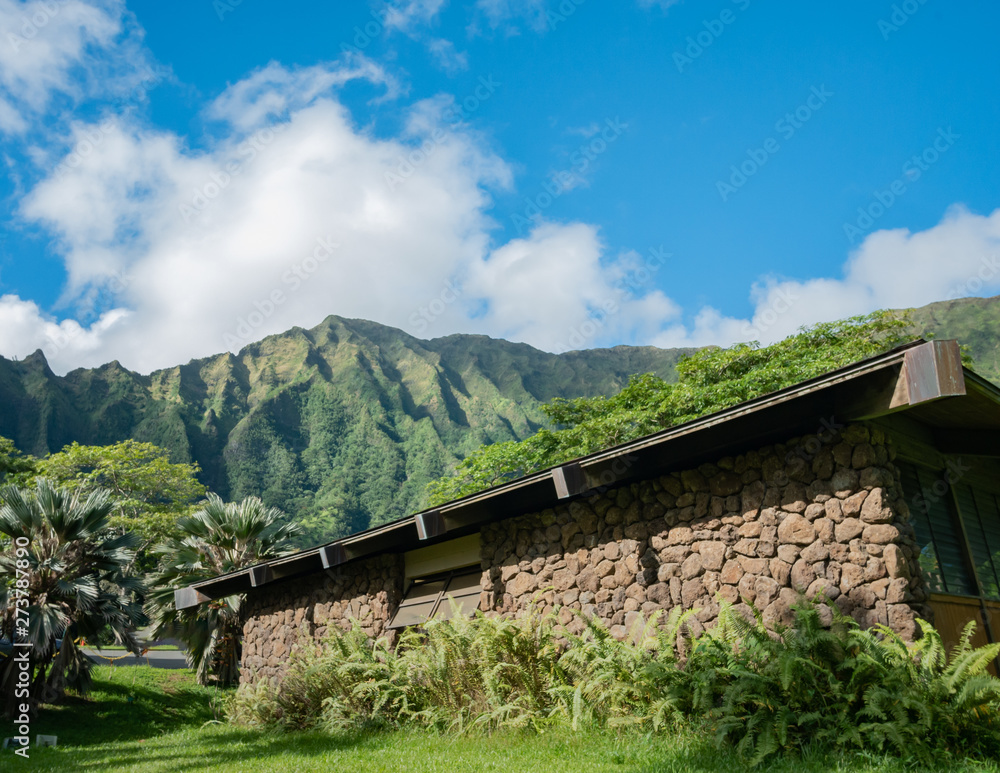 Building with ridge mountains in the background Building with ridge mountains in the background