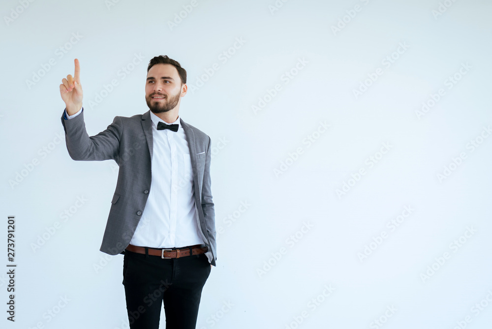 Handsome man with bearded in formal tuxedo and suit showing hand pointing something on white background,Copy space for text and die cut Handsome man with bearded in formal tuxedo and suit showing hand pointing something on white background,Copy space for text and die cut