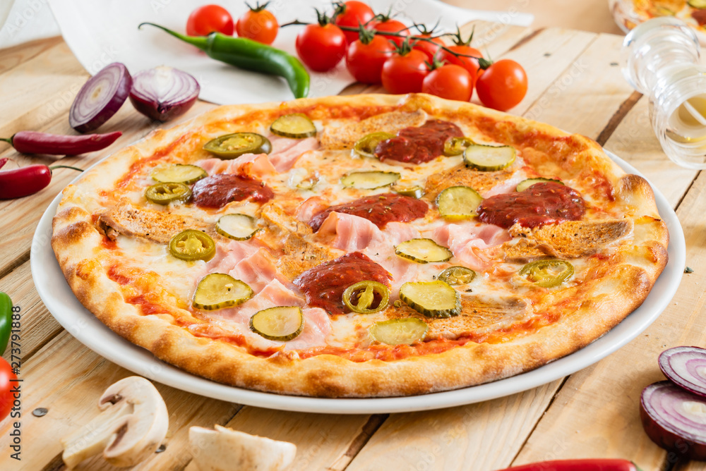 tasty pizza on the wooden background tasty pizza on the wooden background