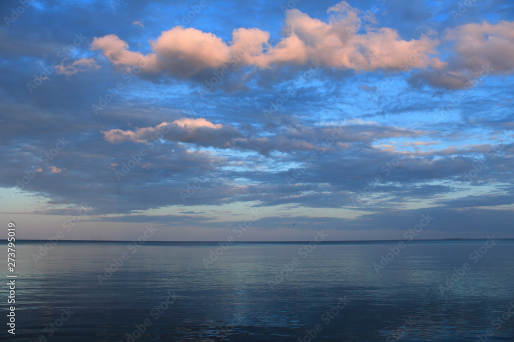 spring sea lake and blue sky and clouds sunset