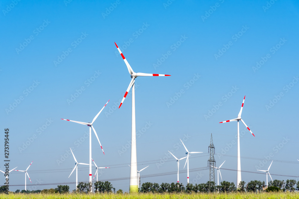 Wind turbines and some overhead power lines seen in Germany Wind turbines and some overhead power lines seen in Germany