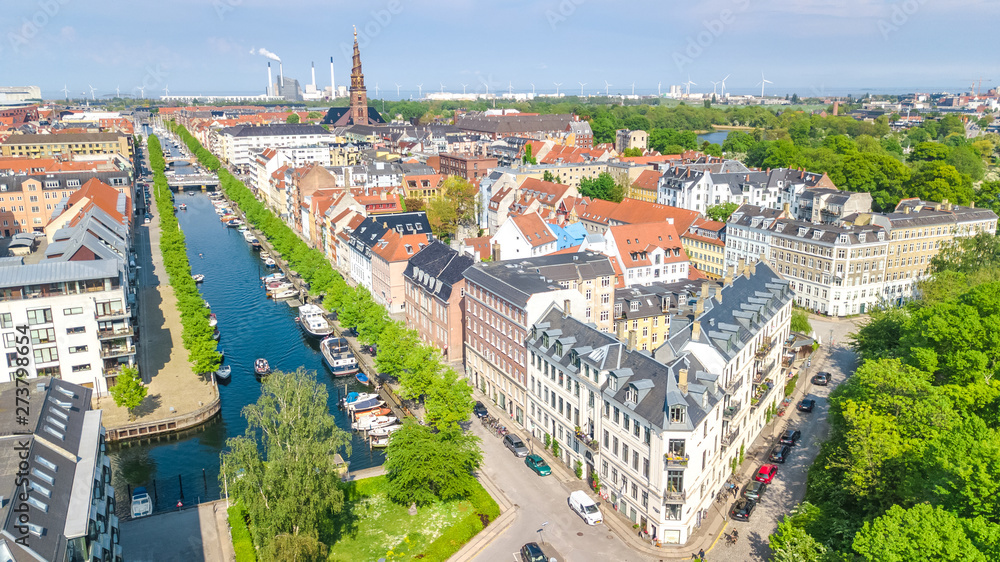 Beautiful aerial view of Copenhagen skyline from above, Nyhavn historical pier port and canal with color buildings and boats in the old town of Copenhagen, Denmark