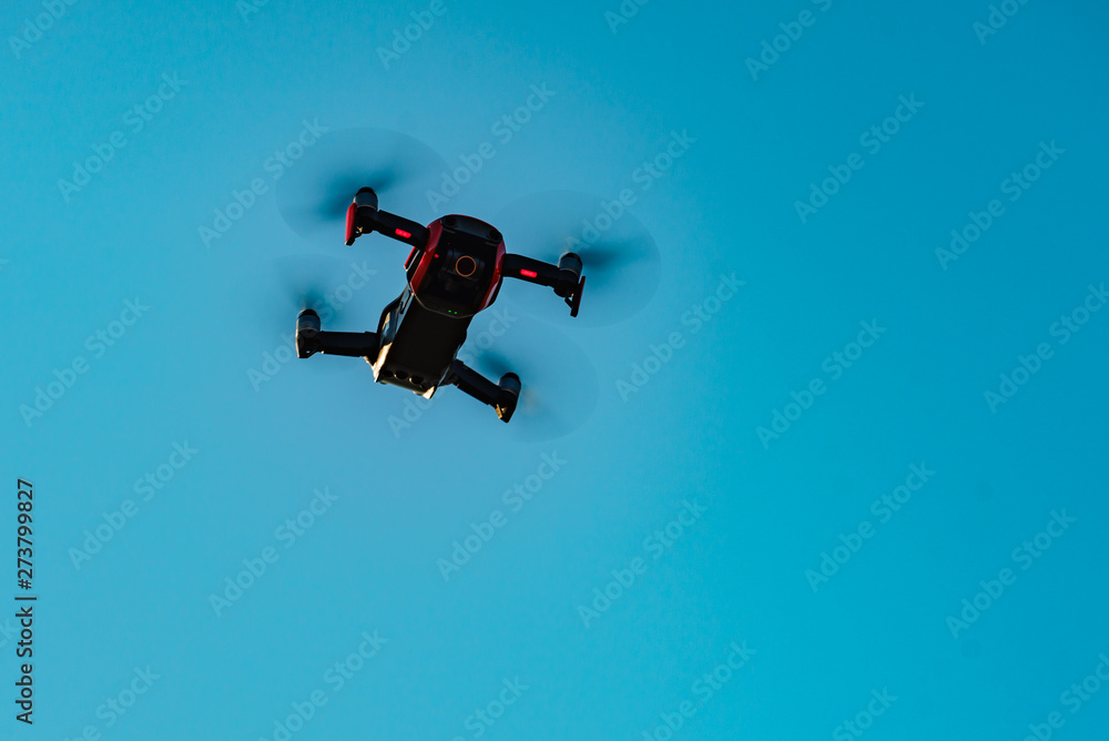 Drone flying over sky background