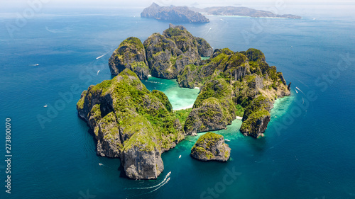 Aerial drone view of tropical Ko Phi Phi island, beaches and boats in blue clear Andaman sea water from above, beautiful archipelago islands of Krabi, Thailand photo