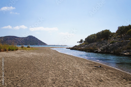 Seashore in Turkey. Summer beach with stones in the bay of the ocean.