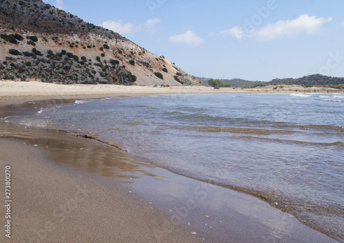 Seashore in Turkey. Summer beach with stones in the bay of the ocean.