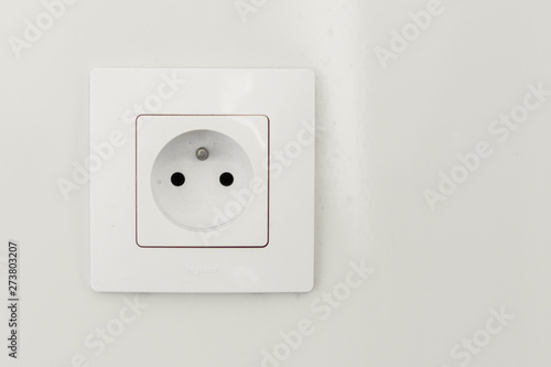 White socket on a white background. Electricity equipment.