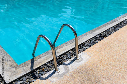 Fototapeta Naklejka Na Ścianę i Meble -  Stainless ladder handrail on swimming pool