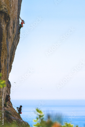 People climbing rock mountain.