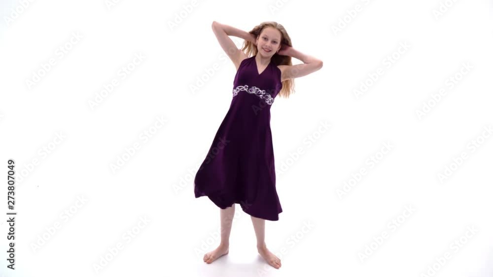 Little girl in a dress developing in the wind. Little girl in a dress developing in the wind.