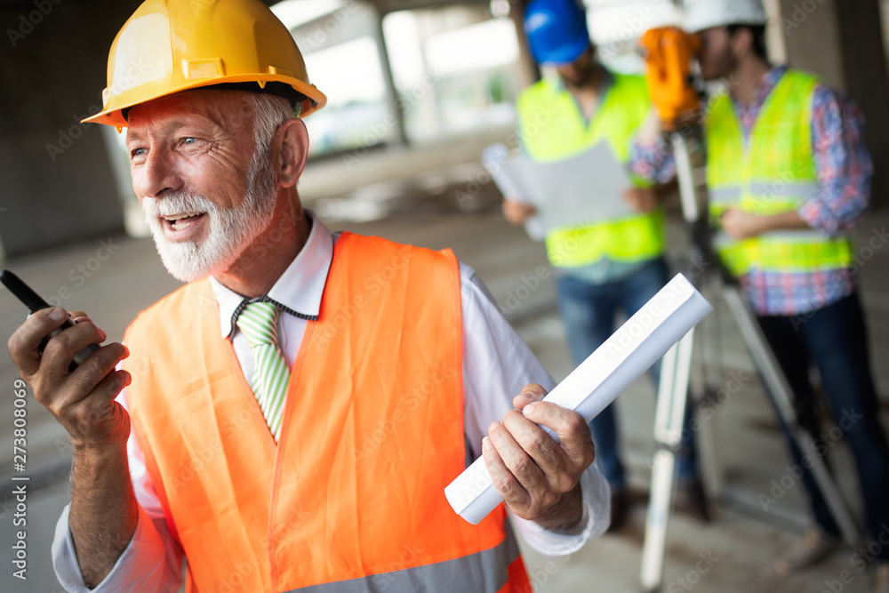 Construction engineer with foreman worker checking construction site Construction engineer with foreman worker checking construction site