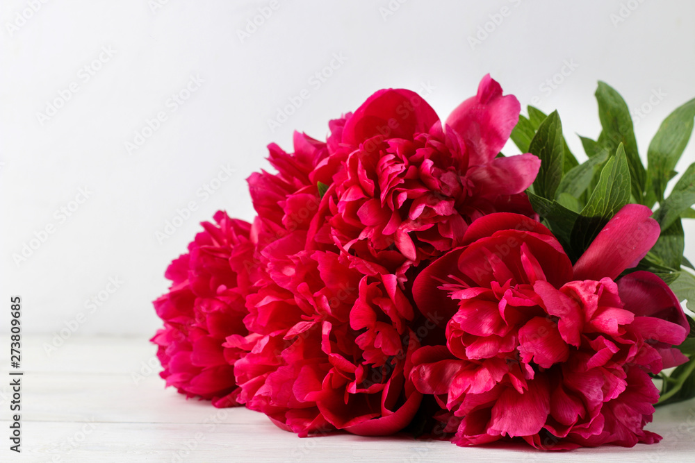 bouquet Beautiful bright pink flowers peonies on a light background. close-up bouquet Beautiful bright pink flowers peonies on a light background. close-up