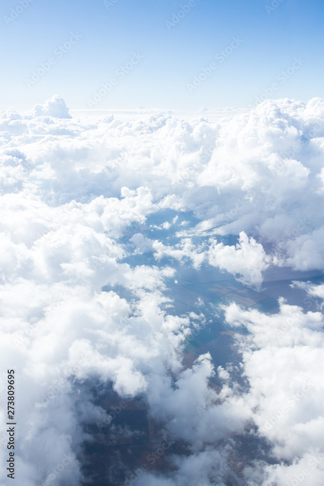 Clouds and sky from airplane window view - obrazy, fototapety, plakaty 