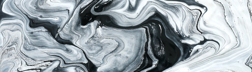 photography of abstract marbleized effect background. black and white creative colors. Beautiful paint. banner