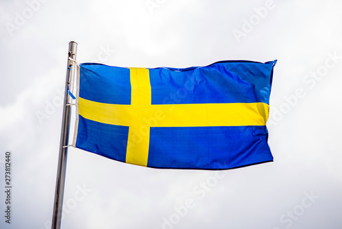  Flag Of Sweden fluttering on a metal flagpole 