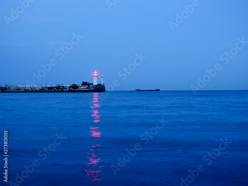lighthouse at sunset in the twilight in clear weather in Crimea © byallasaa