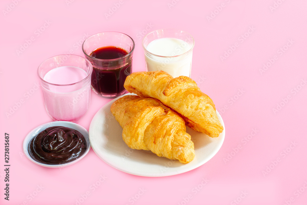 croissants served with glass of Fresh milk, coffee on pink background. Breakfast concept. croissants served with glass of Fresh milk, coffee on pink background. Breakfast concept.