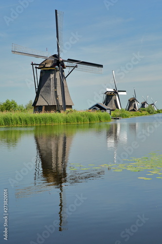 Traditional Windmills within a rural landscape in Kinderdijk (Unesco World Heritage), Netherlands