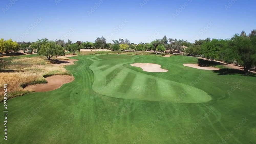 Aerial fly down the fairway to the pin, Scottsdale Arizona. Concept: golf, relaxation, walking Aerial fly down the fairway to the pin, Scottsdale Arizona. Concept: golf, relaxation, walking