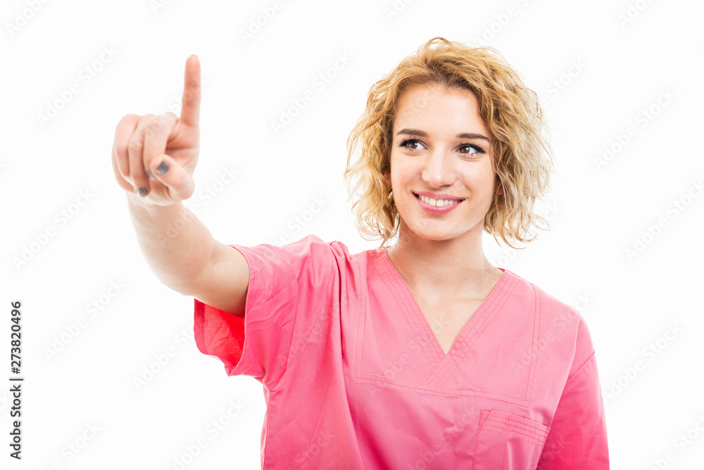 Portrait of young nurse wearing pink scrub using touchscreen Portrait of young nurse wearing pink scrub using touchscreen