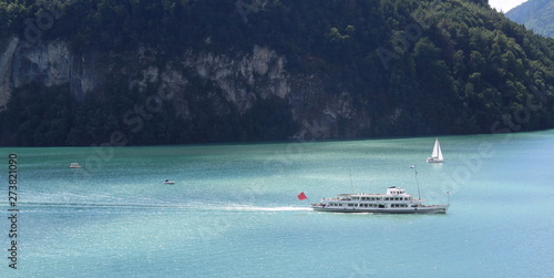 Barca turistica nel lago di montagna - vacanze e relax photo