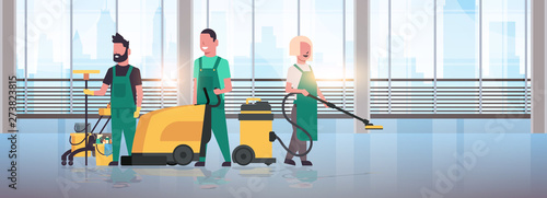 janitors team cleaning service concept cleaners in uniform working together with professional equipment modern hall interior panoramic windows cityscape background flat full length horizontal