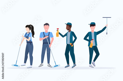 janitors team cleaning service concept woman with mix race men cleaners in uniform working together with professional equipment flat full length horizontal